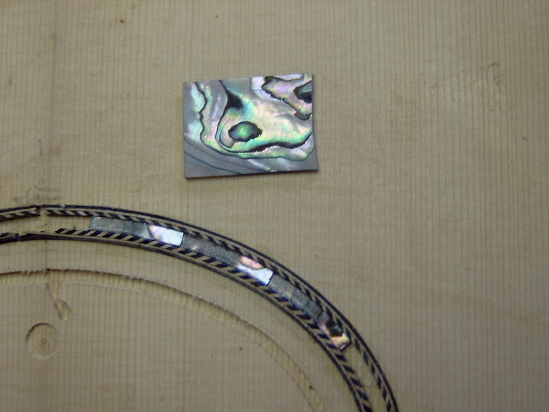 Makingthe abalone inlay. 